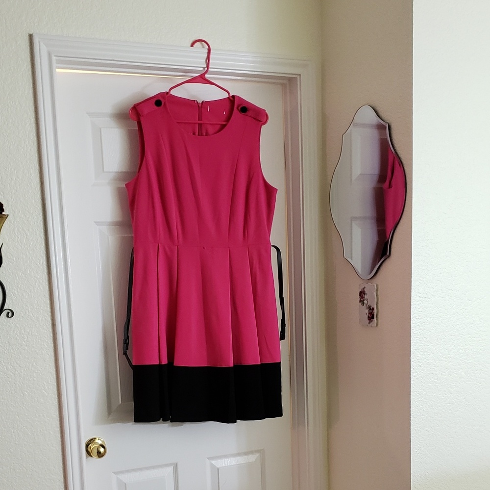 Dark pink dress with wide black hem.